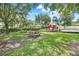Playground featuring picnic tables and a green space, perfect for Gathering gatherings and outdoor activities at 2745 Shearwater St, Clermont, FL 34711