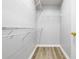 Walk-in closet with built-in shelving and laminate flooring at 2745 Shearwater St, Clermont, FL 34711