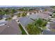 An aerial shot showcases a community of elegant houses with palm trees and manicured lawns at 2987 Kramer Ct, The Villages, FL 32163