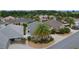 Overhead view shows a beautiful lawn, palm tree, and a well kept roof at 2987 Kramer Ct, The Villages, FL 32163