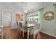 Bright dining room featuring a chandelier, pendant lights, and a beautiful window at 2987 Kramer Ct, The Villages, FL 32163