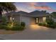 This charming home boasts a two-car garage, well-manicured lawn, and inviting front entrance at 2987 Kramer Ct, The Villages, FL 32163