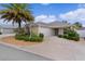 Charming single-story home with a two-car garage and manicured landscaping at 2987 Kramer Ct, The Villages, FL 32163