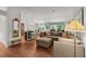 Spacious living room with comfortable seating, hardwood floors, and lots of natural light at 2987 Kramer Ct, The Villages, FL 32163