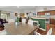 Open floor plan with a view from the dining area to the living room and kitchen at 2987 Kramer Ct, The Villages, FL 32163