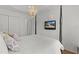 Comfortable main bedroom with a TV, chandelier, and a view to other rooms at 2987 Kramer Ct, The Villages, FL 32163