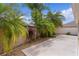 This outdoor patio is accented with Florida landscaping including Palm Trees and small rock ground cover at 2987 Kramer Ct, The Villages, FL 32163