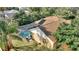 A high angle shot shows the pool with screen enclosure in the back yard of the home at 3310 Osprey Hill St, Clermont, FL 34714