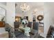 Elegant dining room with chandelier lighting and a glass-top table, great for entertaining at 3310 Osprey Hill St, Clermont, FL 34714