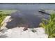 Stunning waterfront property with a sandy beach, personal watercraft, and a private dock at 33943 E Lake Joanna Dr, Eustis, FL 32736