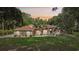 Beautiful single-story home with a neatly landscaped front yard, mature trees, and well-maintained lawn offering great curb appeal at 33943 E Lake Joanna Dr, Eustis, FL 32736