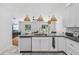 Stylish kitchen with granite counters, stainless appliances, and a breakfast bar overlooking the living area at 33943 E Lake Joanna Dr, Eustis, FL 32736