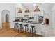 Well-appointed kitchen with white cabinets, granite countertops, stainless steel appliances, and pendant lighting at 33943 E Lake Joanna Dr, Eustis, FL 32736