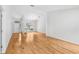 Spacious living room featuring gleaming hardwood floors and ample natural light at 33943 E Lake Joanna Dr, Eustis, FL 32736
