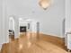 Open-concept living room with fireplace and hardwood floors at 33943 E Lake Joanna Dr, Eustis, FL 32736