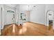 Spacious living room with hardwood floors and arched doorways at 33943 E Lake Joanna Dr, Eustis, FL 32736