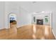 Large living room with hardwood floors, fireplace, and ample natural light at 33943 E Lake Joanna Dr, Eustis, FL 32736