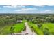 Lush green property featuring expansive lawn and private access to beach area at 33943 E Lake Joanna Dr, Eustis, FL 32736