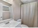 Well lit bathroom with shower, toilet, mirror and vanity with sink at 4 Kristin Ln, Eustis, FL 32726
