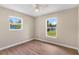 Bedroom with new floors, ceiling fan, and great natural light at 4 Kristin Ln, Eustis, FL 32726