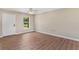 A bright bedroom with updated flooring, a ceiling fan, a fresh paint job, and natural light at 4 Kristin Ln, Eustis, FL 32726