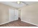 Bedroom with new floors, closet, and ceiling fan at 4 Kristin Ln, Eustis, FL 32726