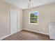 Cozy dining area featuring modern light fixture, durable floors, and natural light near the updated kitchen at 4 Kristin Ln, Eustis, FL 32726