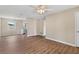 A spacious living room with modern floors that flows seamlessly into the updated kitchen at 4 Kristin Ln, Eustis, FL 32726