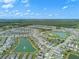 Expansive community with serene lakes, lush green spaces, and a beautiful amenity center at 424 Noble Ave, Davenport, FL 33837