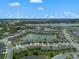 Aerial view of community, showing water features, landscaping, and neighborhood layout at 424 Noble Ave, Davenport, FL 33837