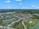 Primary-planned community featuring multiple lakes, community pool, playground, and lush landscaping at 424 Noble Ave, Davenport, FL 33837