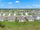 Aerial view of the property showcasing its location, backyard, and surrounding landscape at 424 Noble Ave, Davenport, FL 33837