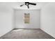 Bedroom featuring neutral carpet, a ceiling fan, and window to the outside at 424 Noble Ave, Davenport, FL 33837