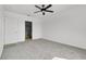 A spacious bedroom with carpet flooring and an ensuite bathroom at 424 Noble Ave, Davenport, FL 33837