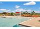 Beautiful community pool with splashpad, and plenty of lounge chairs to relax at 424 Noble Ave, Davenport, FL 33837