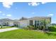 Charming single Gathering home featuring a manicured lawn and attached two car garage at 424 Noble Ave, Davenport, FL 33837