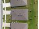 Aerial of a roof showing its architectural design and position among neighboring homes at 424 Noble Ave, Davenport, FL 33837