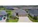 Aerial view of this well-maintained single-Gathering home with a two-car garage and lovely landscaping at 4346 Pezzullo Cir, The Villages, FL 32163