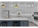 Bright, spacious kitchen with a large island, stainless steel appliances, and elegant white cabinetry at 4346 Pezzullo Cir, The Villages, FL 32163