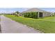 A cozy screened patio surrounded by lush landscaping enhances outdoor living and privacy at 4346 Pezzullo Cir, The Villages, FL 32163