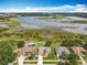 Aerial view of the homes, with a lake in the distance at 439 Gentle Breeze Dr, Minneola, FL 34715