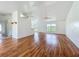 Bright, spacious living area with hardwood floors, high ceilings, and large windows offering natural light at 439 Gentle Breeze Dr, Minneola, FL 34715