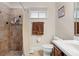 Cozy bathroom with tiled shower, neutral walls, and vanity with storage at 5144 Rishley Run Way, Mount Dora, FL 32757