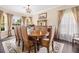 Formal dining room with elegant table and chairs, perfect for entertaining guests at 5144 Rishley Run Way, Mount Dora, FL 32757
