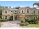 Beautiful two-story home with lush landscaping, manicured lawn, and a well-maintained driveway at 5144 Rishley Run Way, Mount Dora, FL 32757