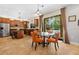 Open-concept kitchen with adjacent breakfast nook and sliding glass doors to the outdoor pool area at 5144 Rishley Run Way, Mount Dora, FL 32757