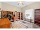 Home office with built-in shelving, a desk, and a neutral color scheme creating a functional space at 5144 Rishley Run Way, Mount Dora, FL 32757