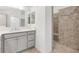 Modern bathroom featuring a gray vanity and luxurious walk-in shower at 5868 Wood Stork Way, The Villages, FL 32163