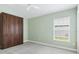 Inviting bedroom with a hidden Murphy bed and neutral decor at 5868 Wood Stork Way, The Villages, FL 32163