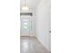 Bright foyer featuring tiled floors and natural light, creating an inviting entrance to the home at 5868 Wood Stork Way, The Villages, FL 32163